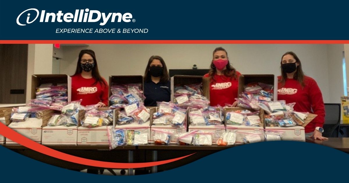 Photo of IntelliDyne Military Resource Group Members packing snack packages